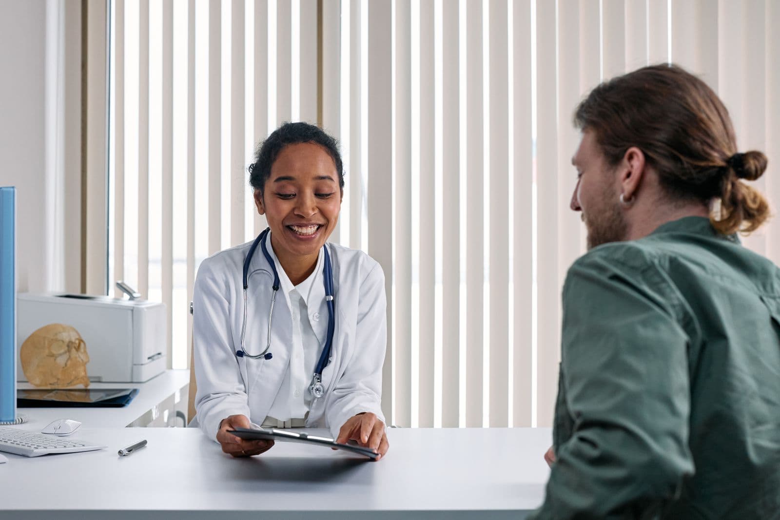 A provider reviewing flat-rate prices with a patient